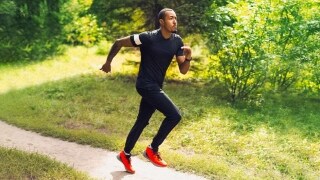Shot of a male running in a park